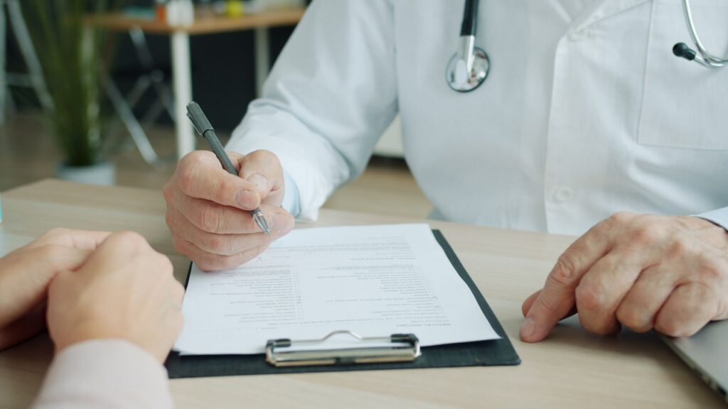 Doctor and patient reviewing medical documents