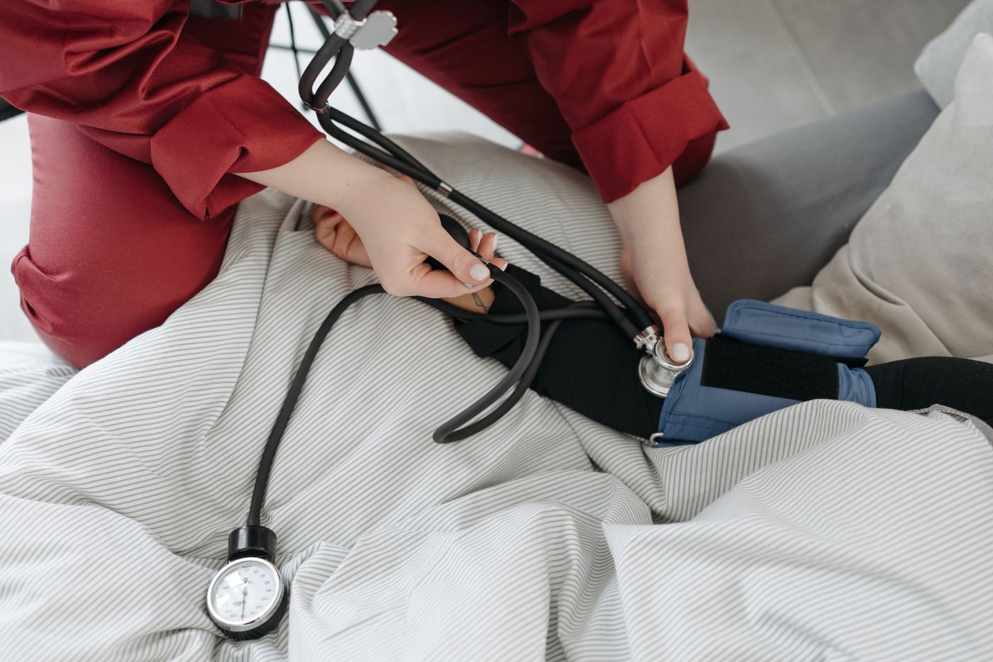 Medical professional checking a patient's blood pressure