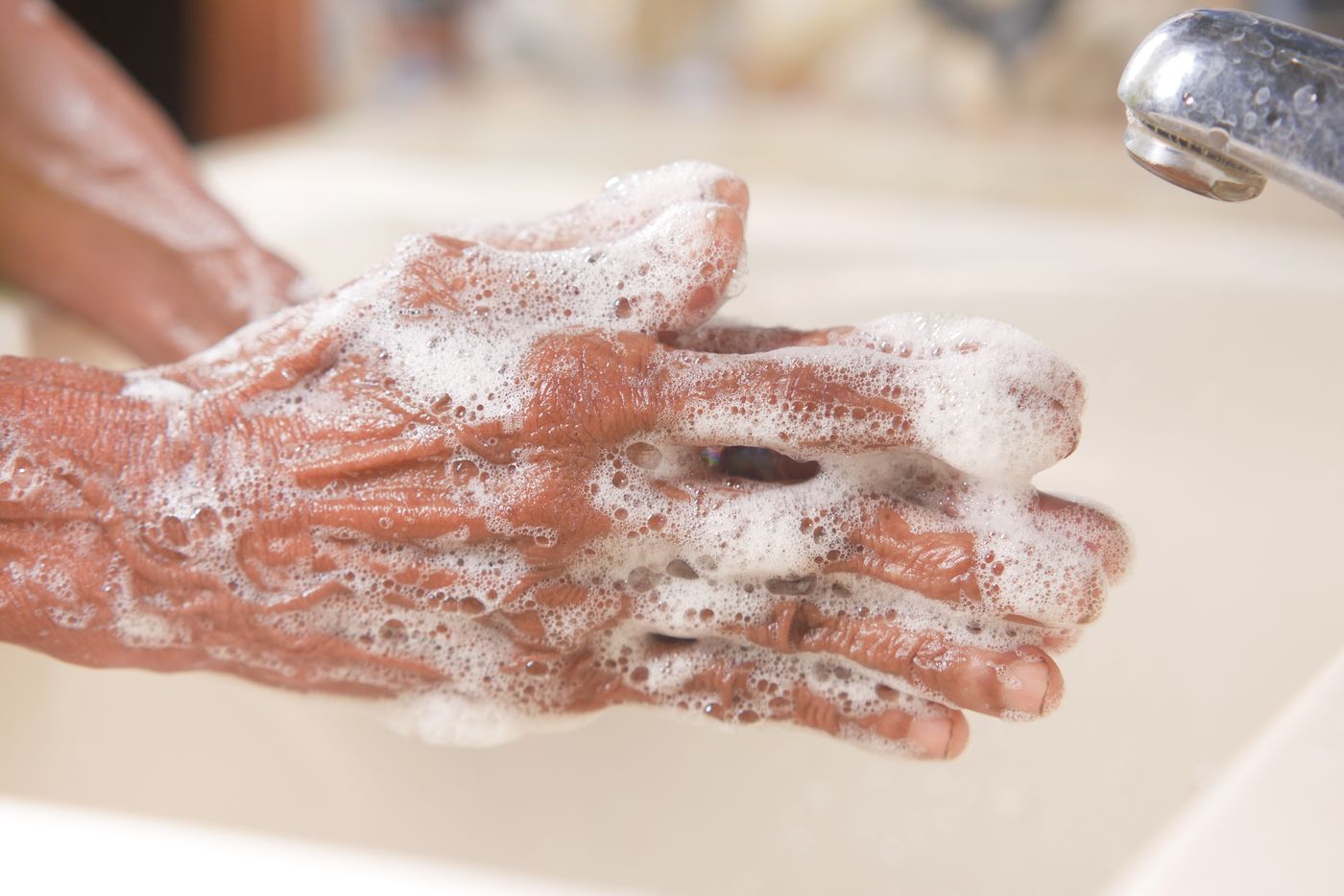 Hands covered in soap lather