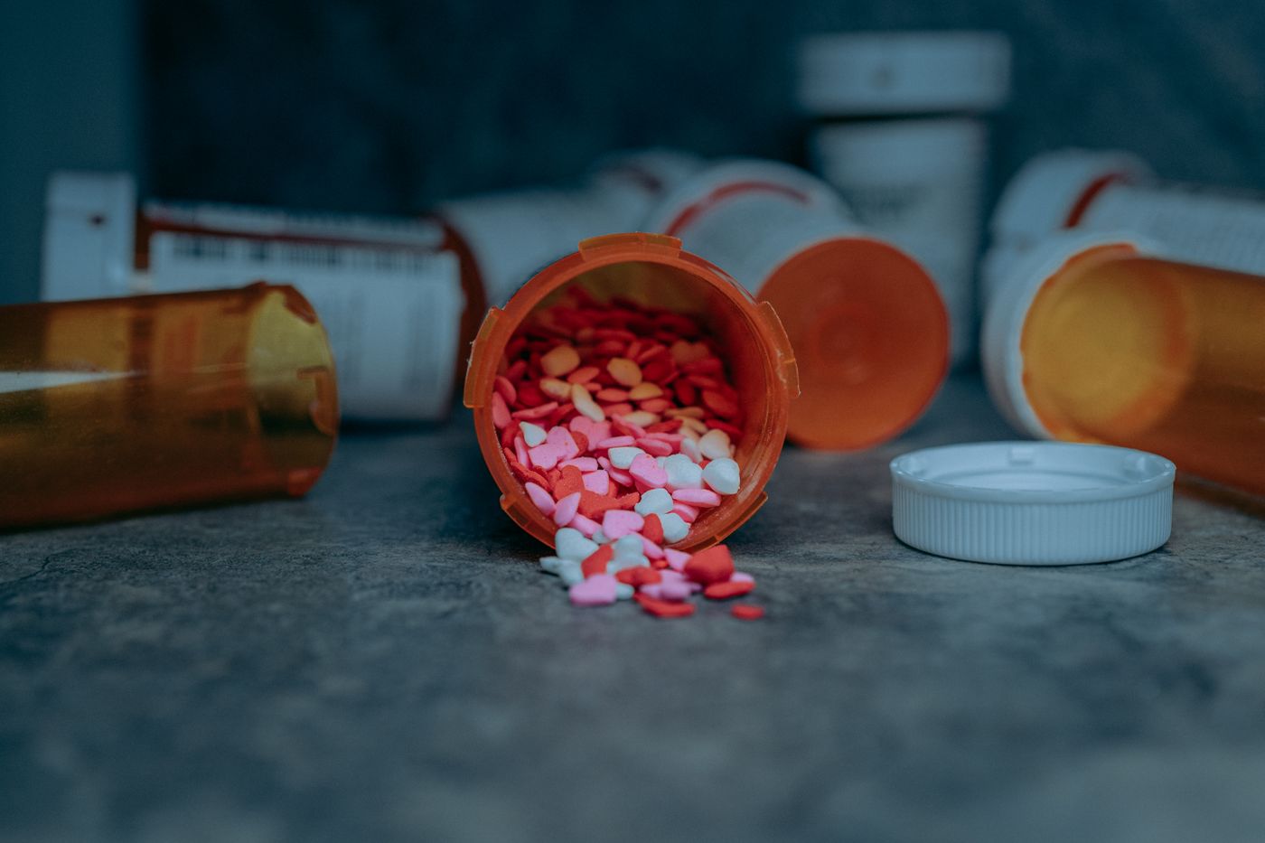 Prescription bottle with pills on a counter